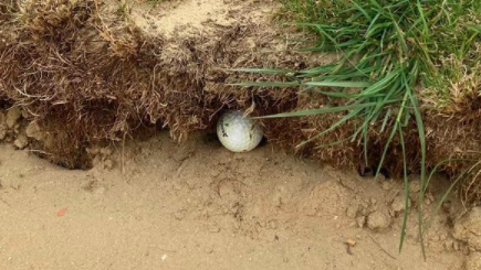 Rules Debate: Is this golf ball classed as IN THE BUNKER?